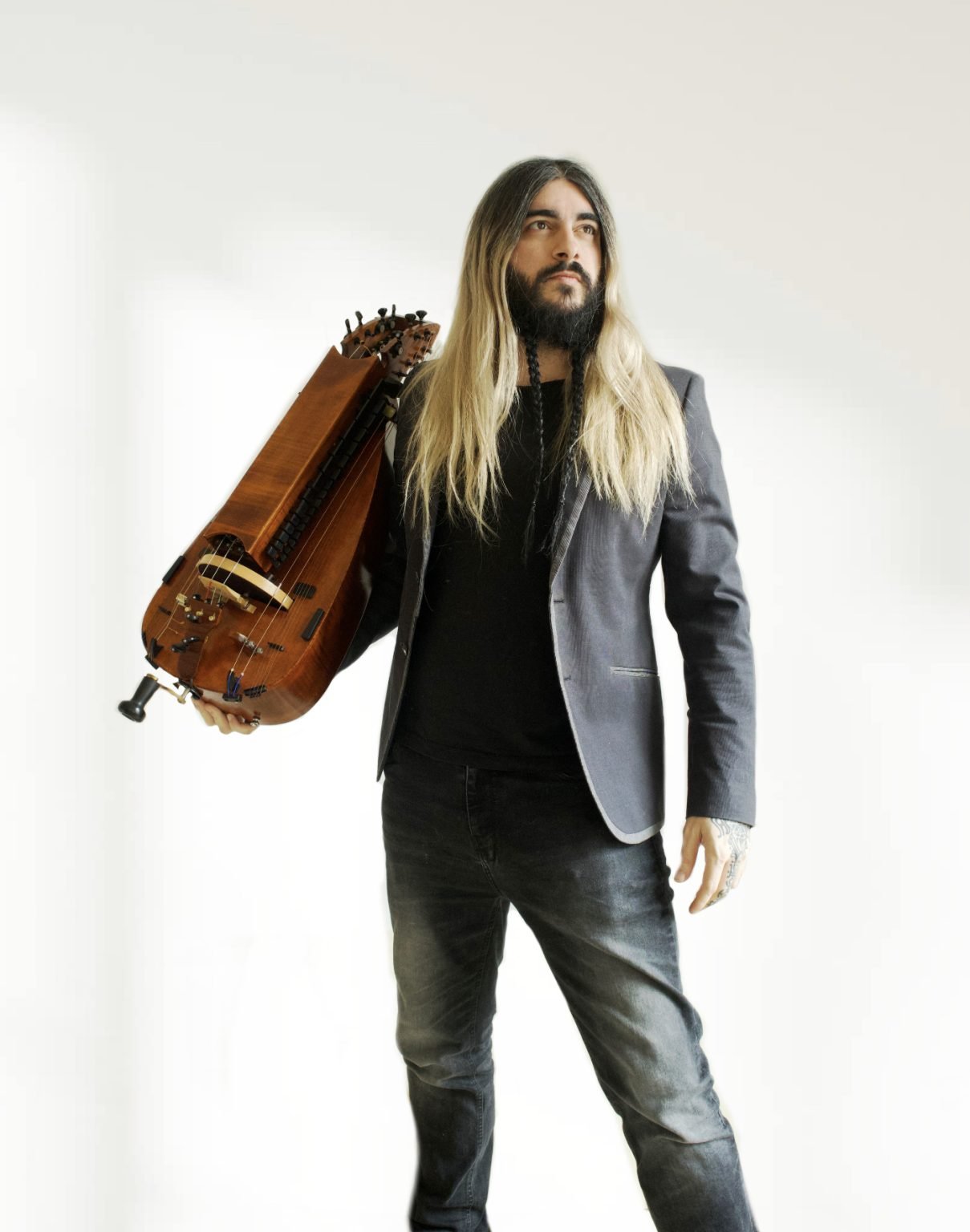 Sergio González Prats holding his hurdy-gurdy