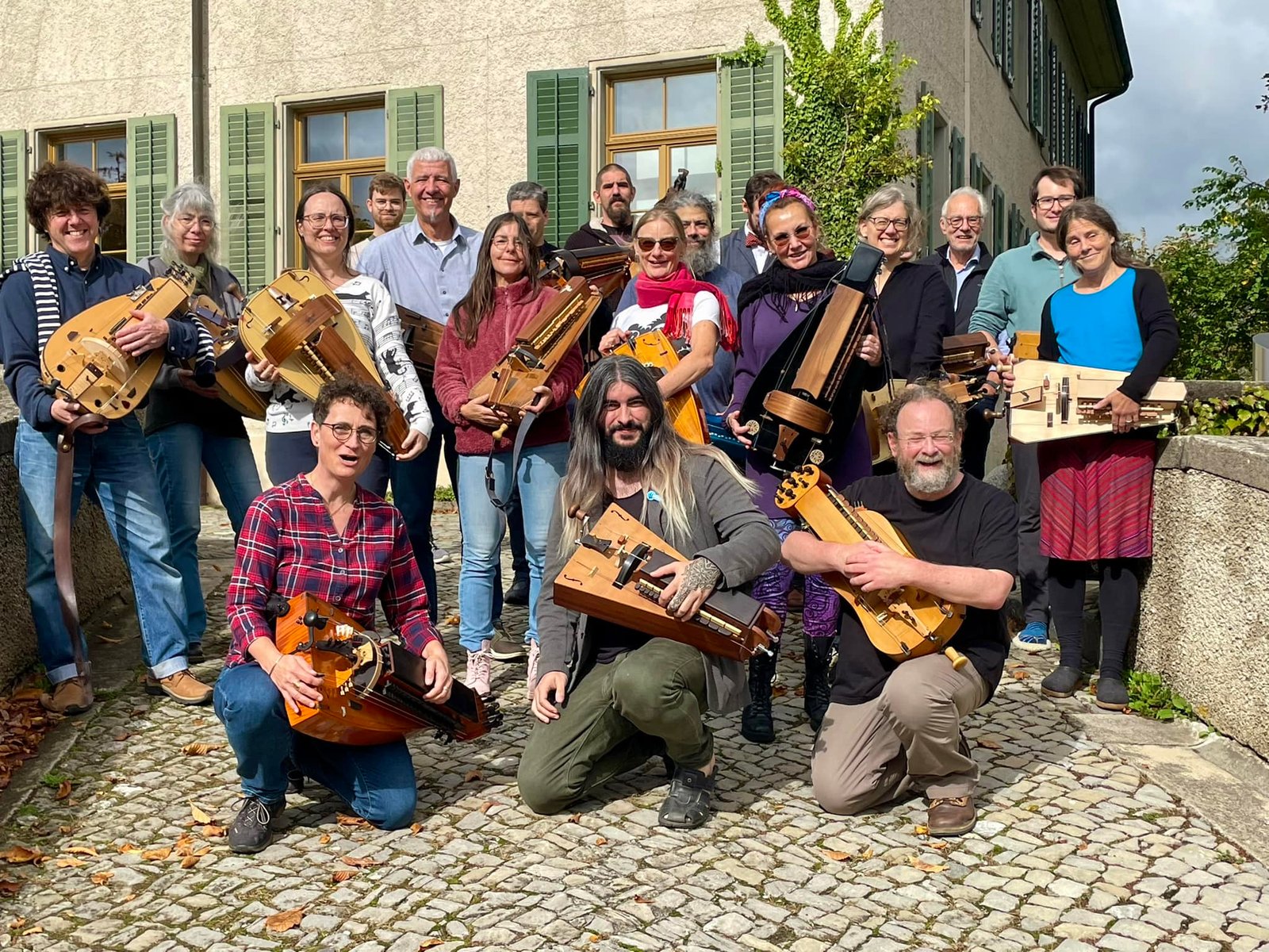 Sergio surrounded by players at a hurdy-gurdy workshop in Switzerland